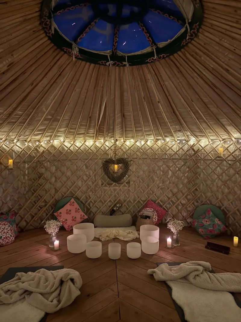 Private ceremony inside the yurt with crystal singing bowls and candles
