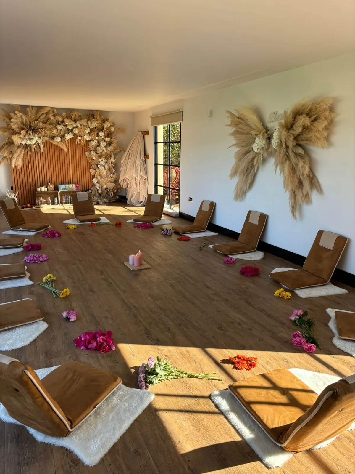 Ceremony circle with pampas grass and scattered flowers